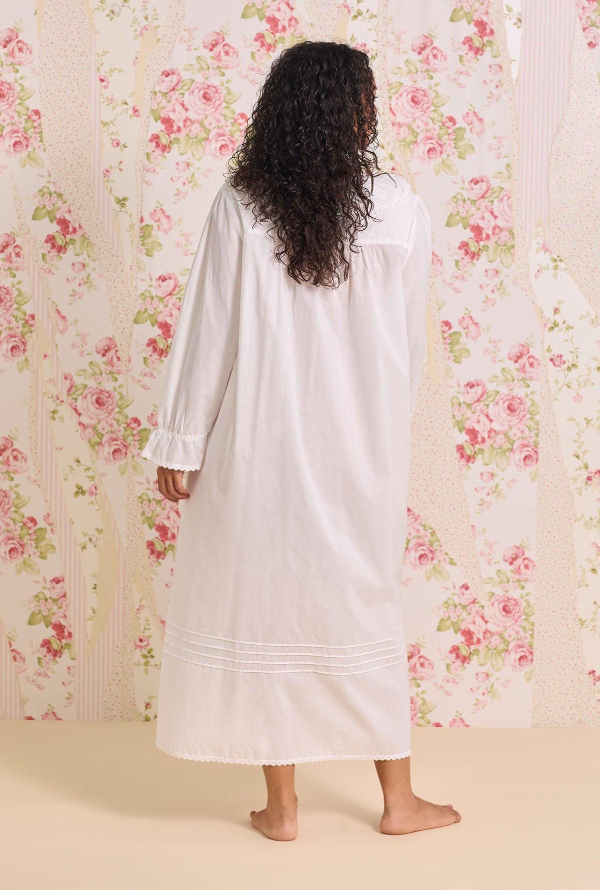 A lady wearing The "Clara" Iconic White Cotton Lawn Plus Nightdress