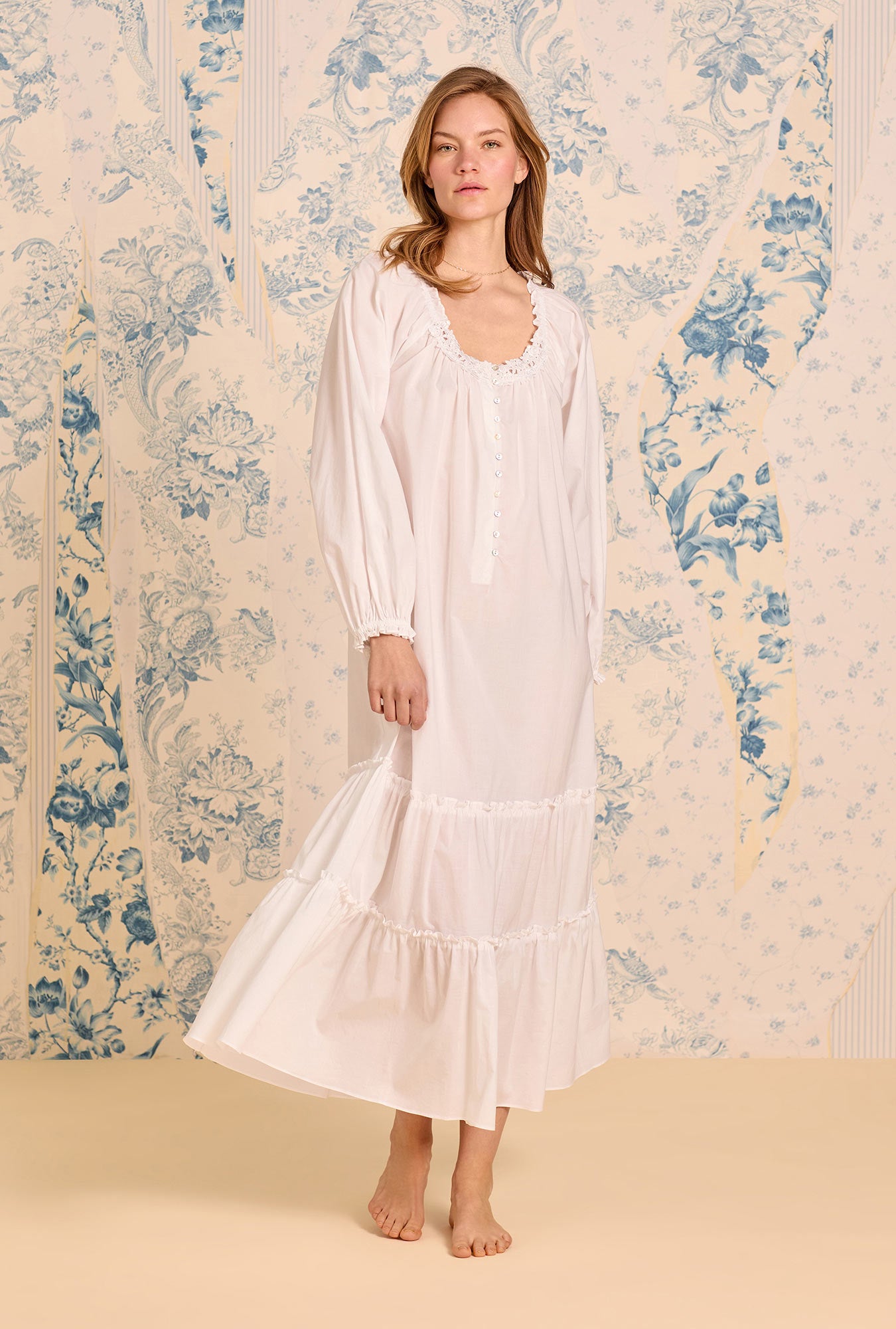 A lady wearing The "Collete" Iconic White Cotton Lawn Nightgown
