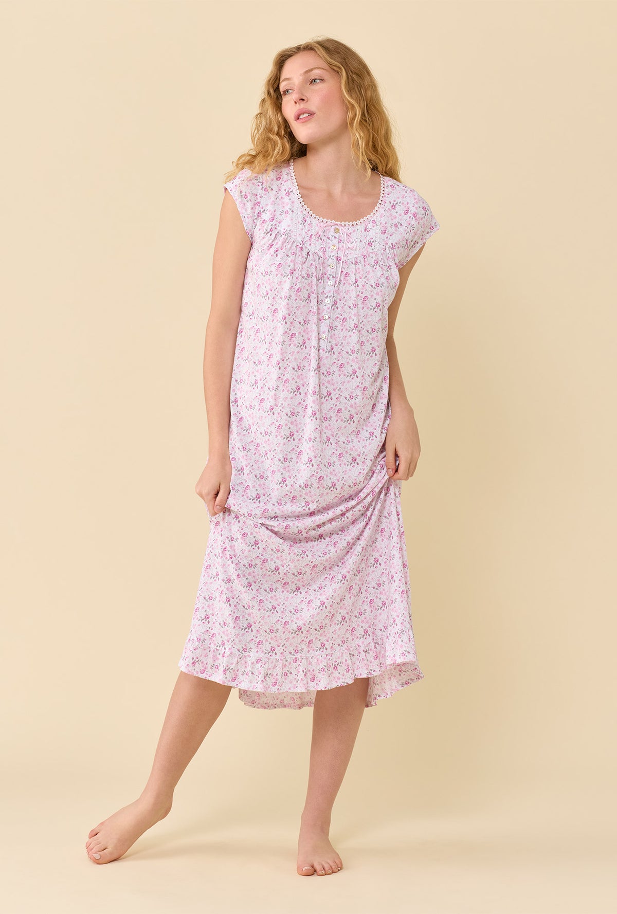 A lady wearing Cameo Ditsy 100% Cotton Jersey Knit Cap Sleeve Ballet Nightgown looking up