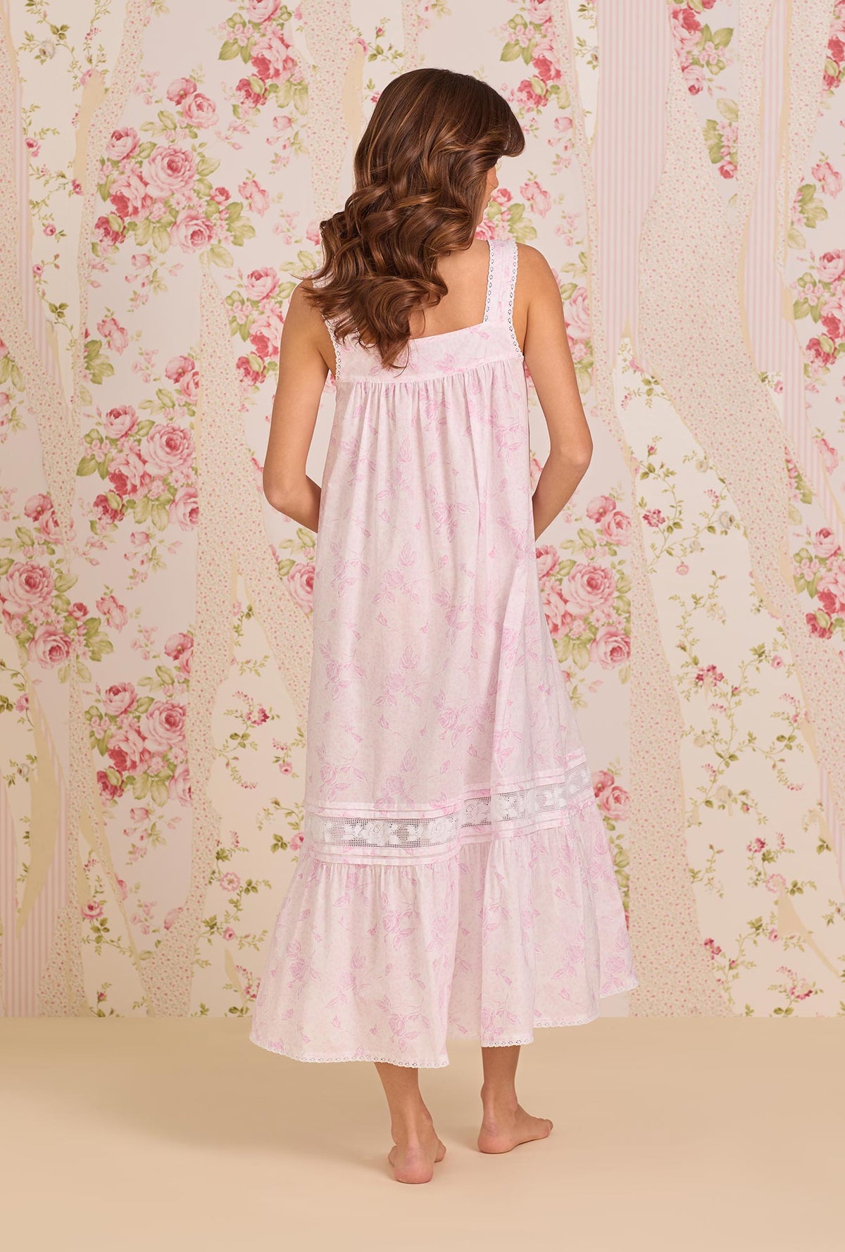 A Lady Wearing The "Adrianna" Blush Rose Cotton Lawn Ballet Nightgown posing back view of the dress