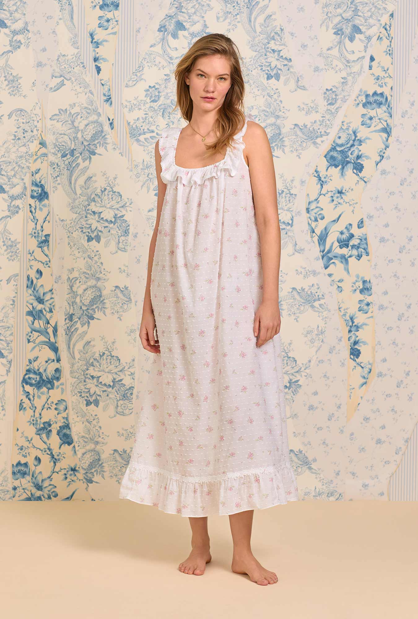 A lady wearing The "Elizabeth" Sweet Pink Floral Swiss Dot Long Nightgown