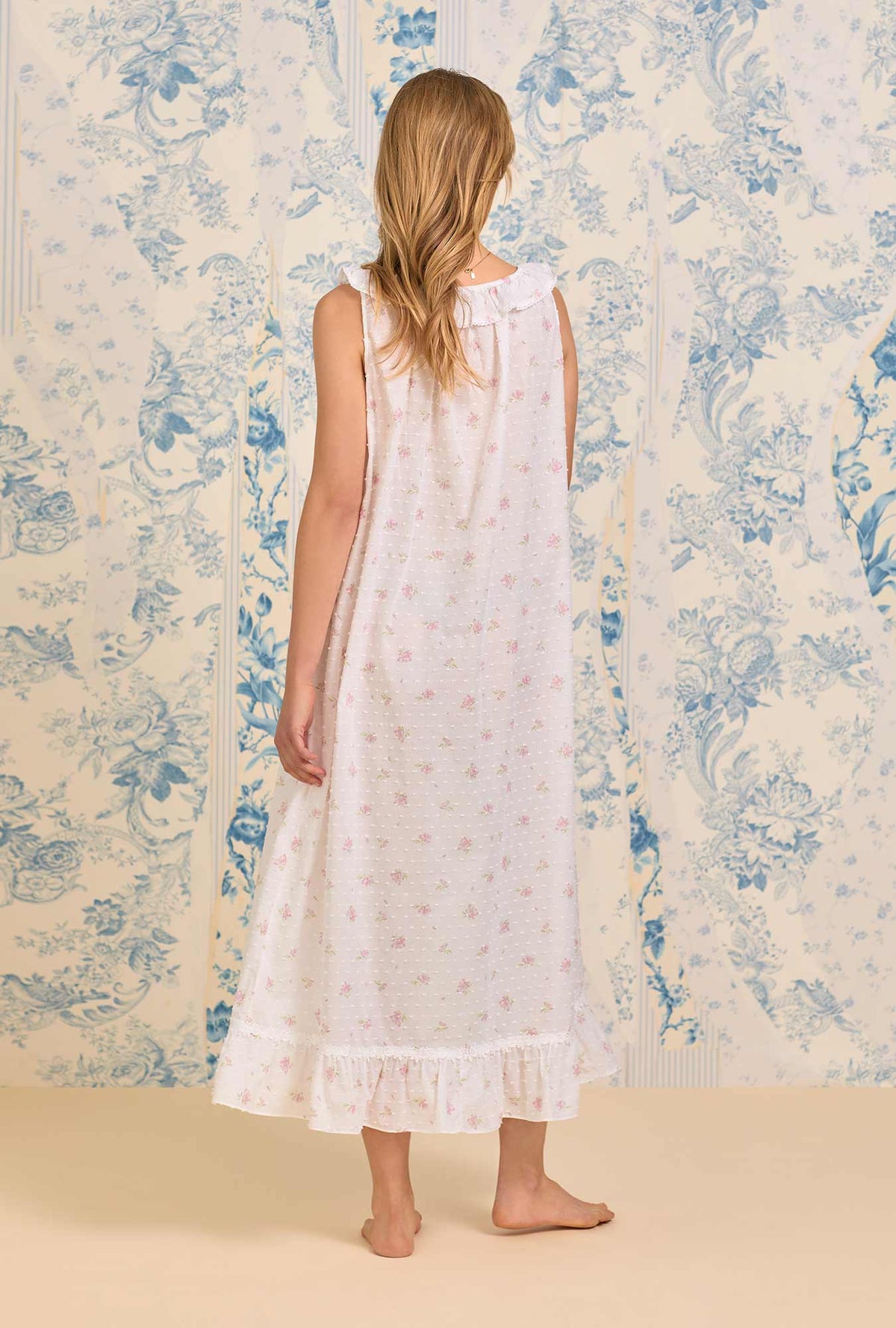 A lady wearing The &quot;Elizabeth&quot; Sweet Pink Floral Swiss Dot Long Nightgown