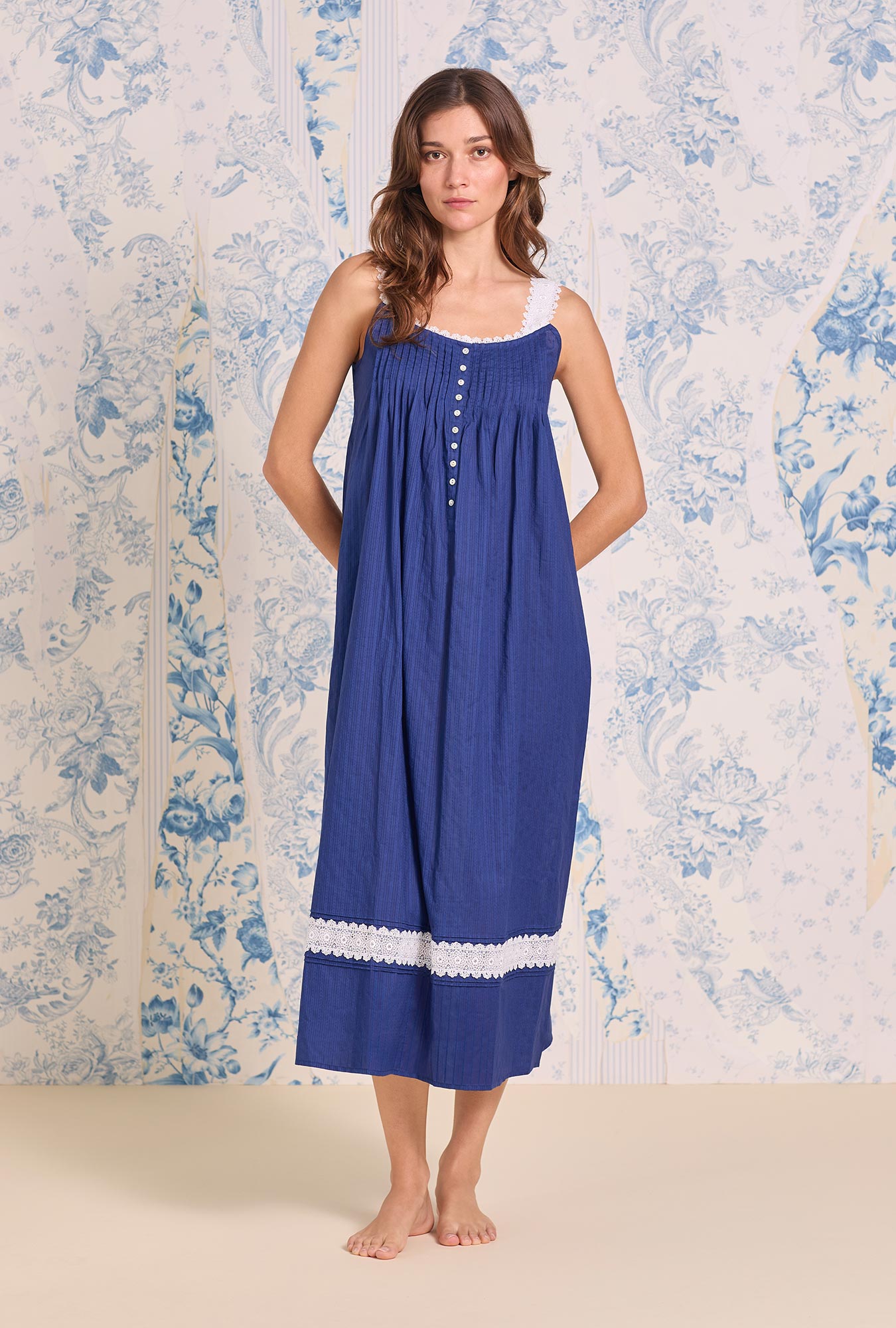 A lady wearing blue Dobby Stripe Gown