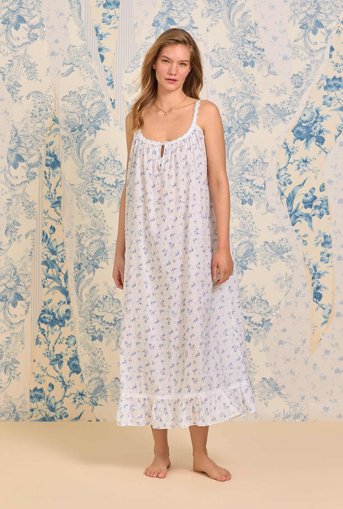 A lady wearing The &quot;Rosalie&quot; Navy Floral Swiss Dot Long Nightgown