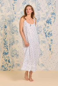 A lady wearing The "Rosalie" Navy Floral Swiss Dot Long Nightgown