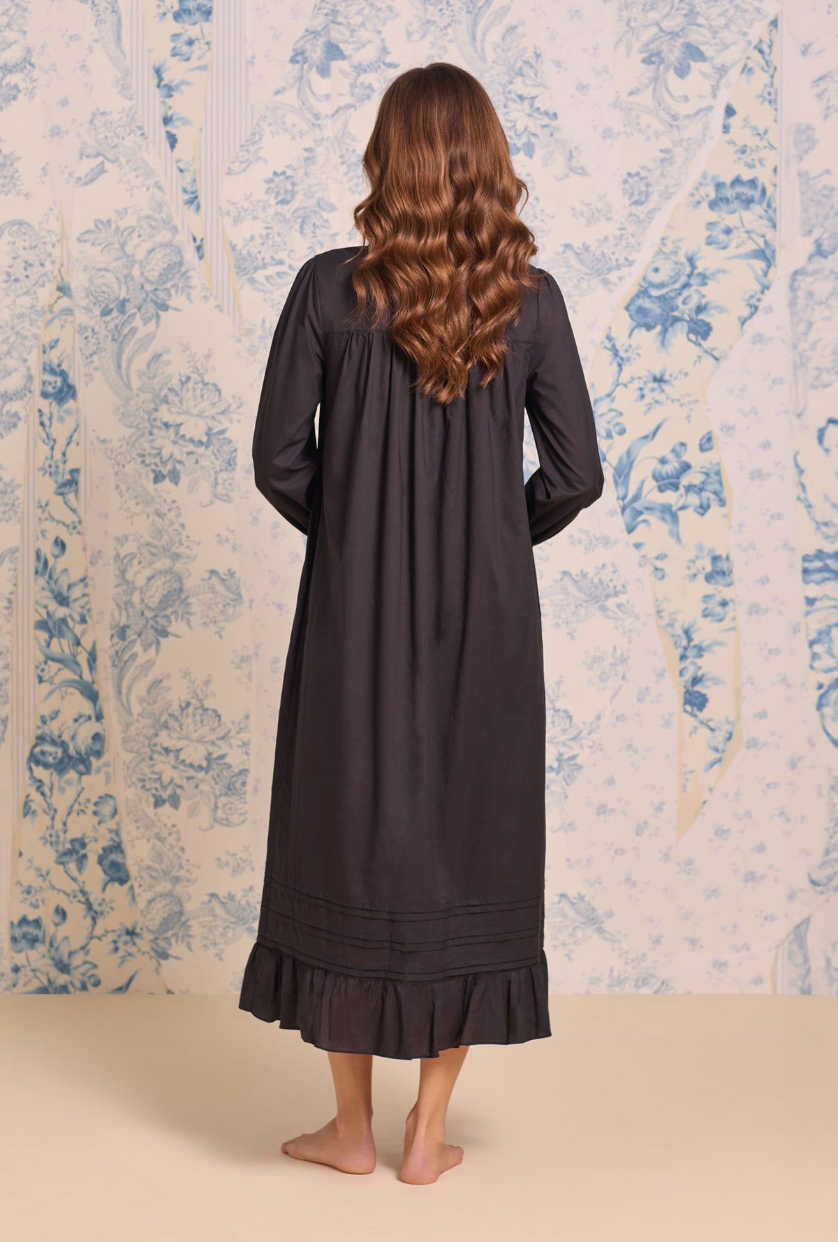 A Lady wearing Iconic Black Cotton Lawn Long Sleeve Baller Nightgown
