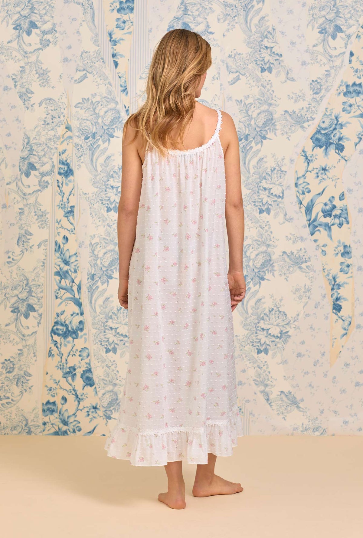 A lady wearing The &quot;Rosalie&quot; Sweet Pink Floral Swiss Dot Long Nightgown