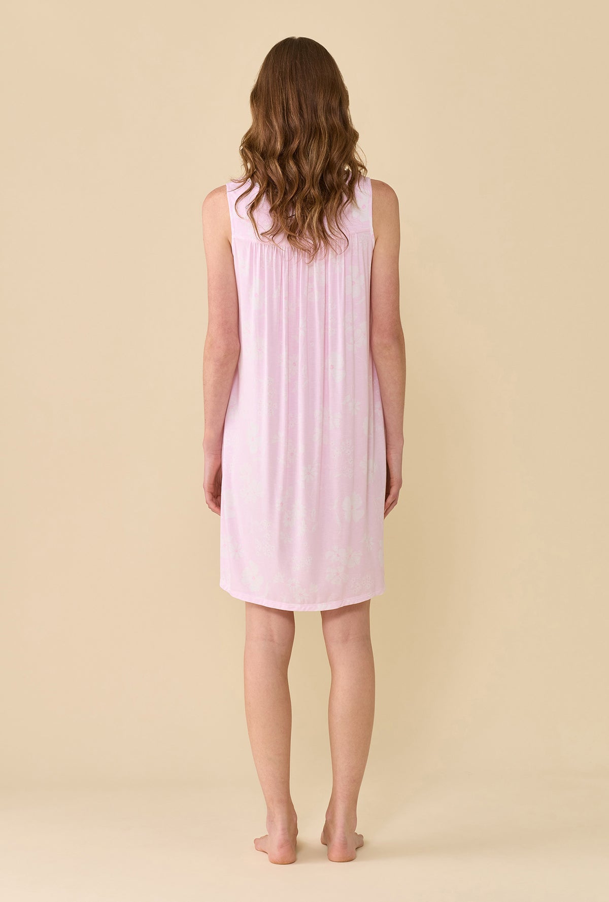 A Lady Wearing Pink Posy Tencel™ Modal Chemise facing back in a straight standing pose