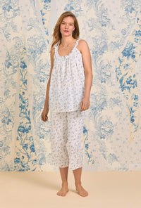A lady wearing The "Rosalie" Navy Floral Swiss Dot Cami Pajama Set