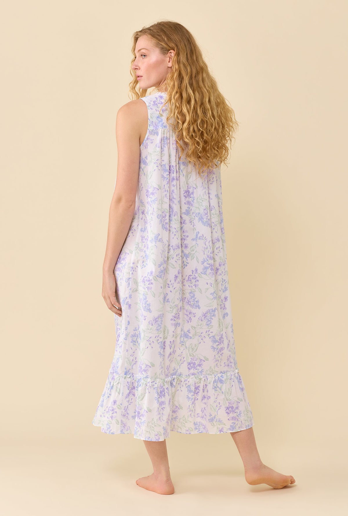 A Lady Wearing The Eileen Blooming Arbor Nightgown in a back view pose