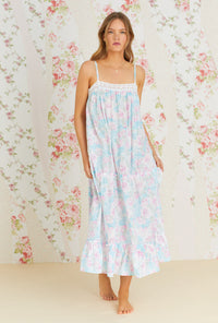 A lady wearing multi color sleeveless cotton nightgown with monterey bay print.