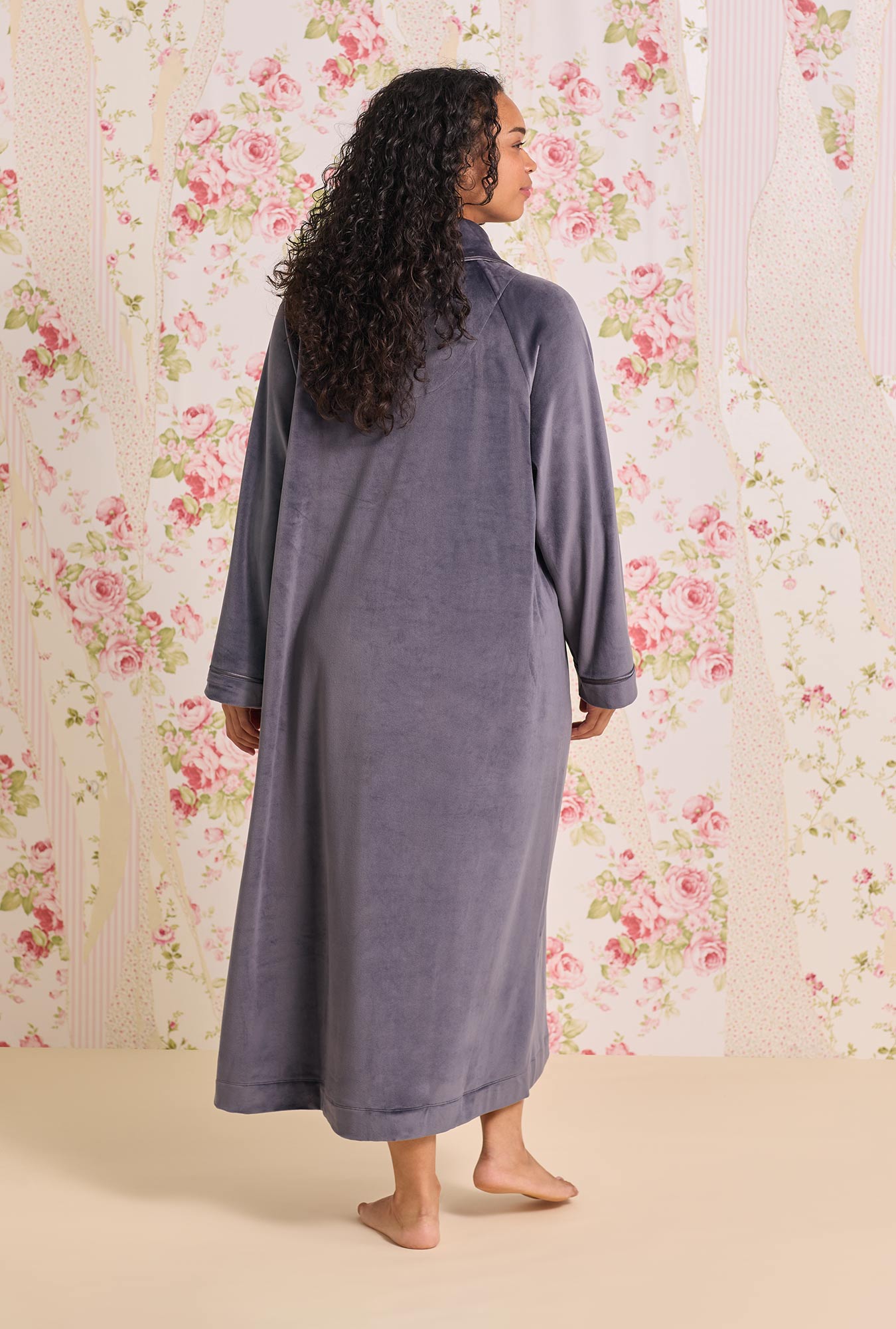 A lady wearing Lux Velour Long Zip Robe