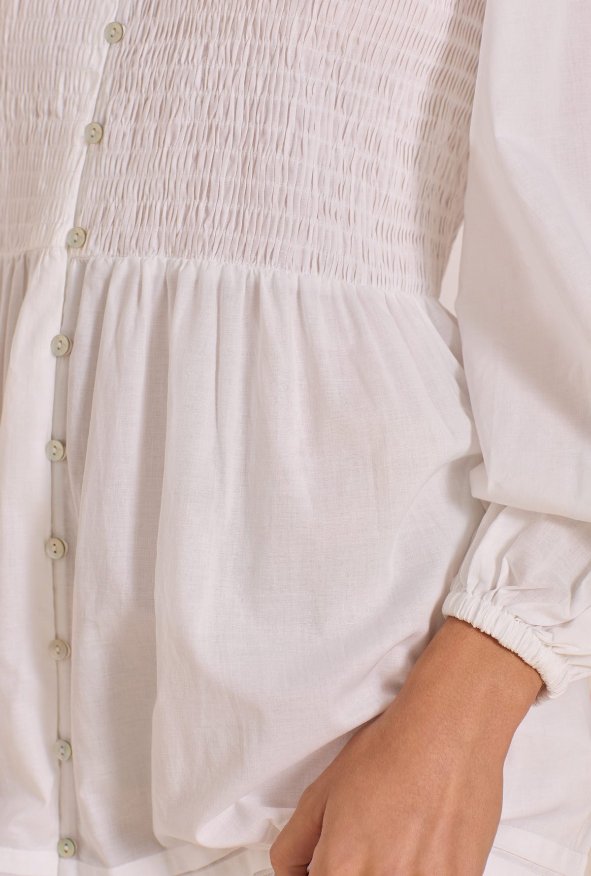 A lady wearing The "Hannah" Iconic White Cotton Lawn Button Front Nightgown