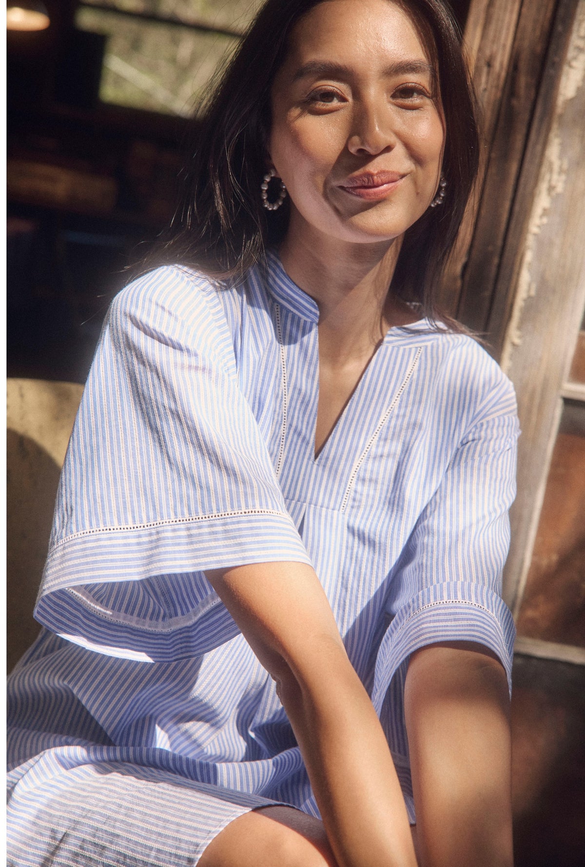 A lady wearing The &quot;Lana&quot; Classic Cotton Stripe Caftan