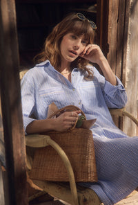 A lady wearing The "Mira" Classic Cotton Stripe Long Shirt Dress