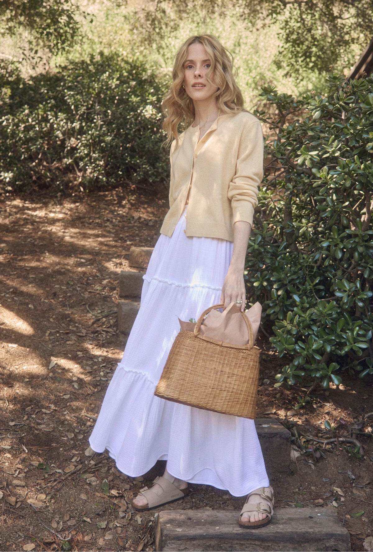 A lady wearing The &quot;Marina&quot; White Crinkle Gauze Maxi Skirt