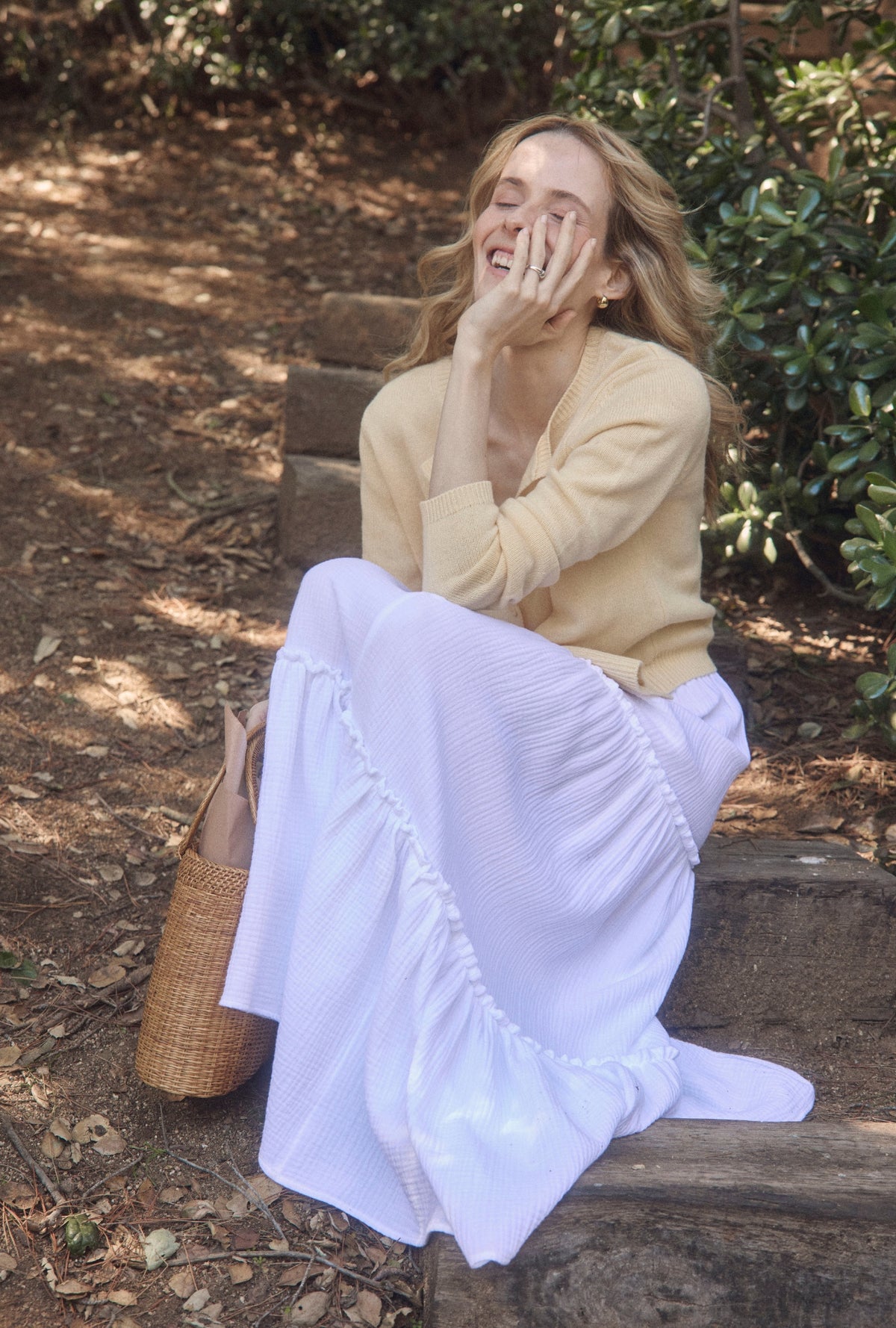 A lady wearing The &quot;Marina&quot; White Crinkle Gauze Maxi Skirt