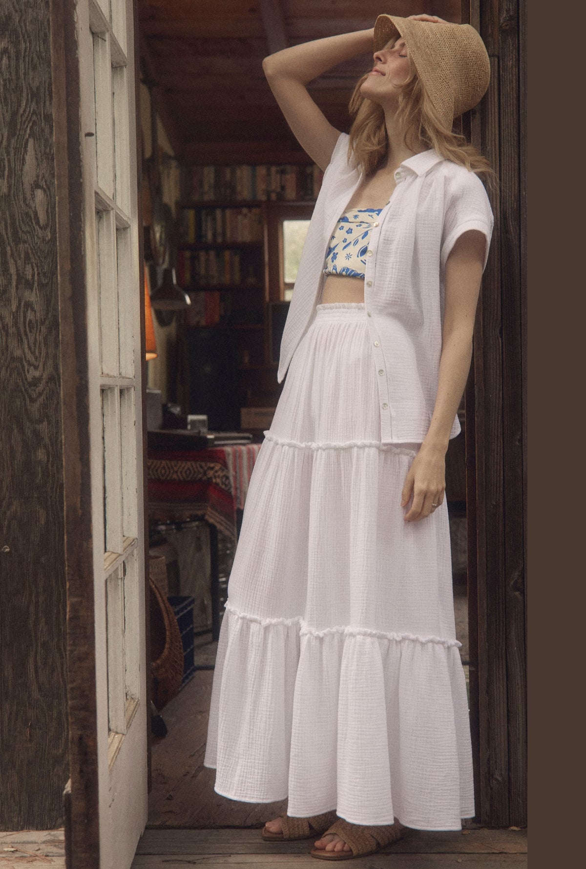 A lady wearing The &quot;Marina&quot; White Crinkle Gauze Maxi Skirt