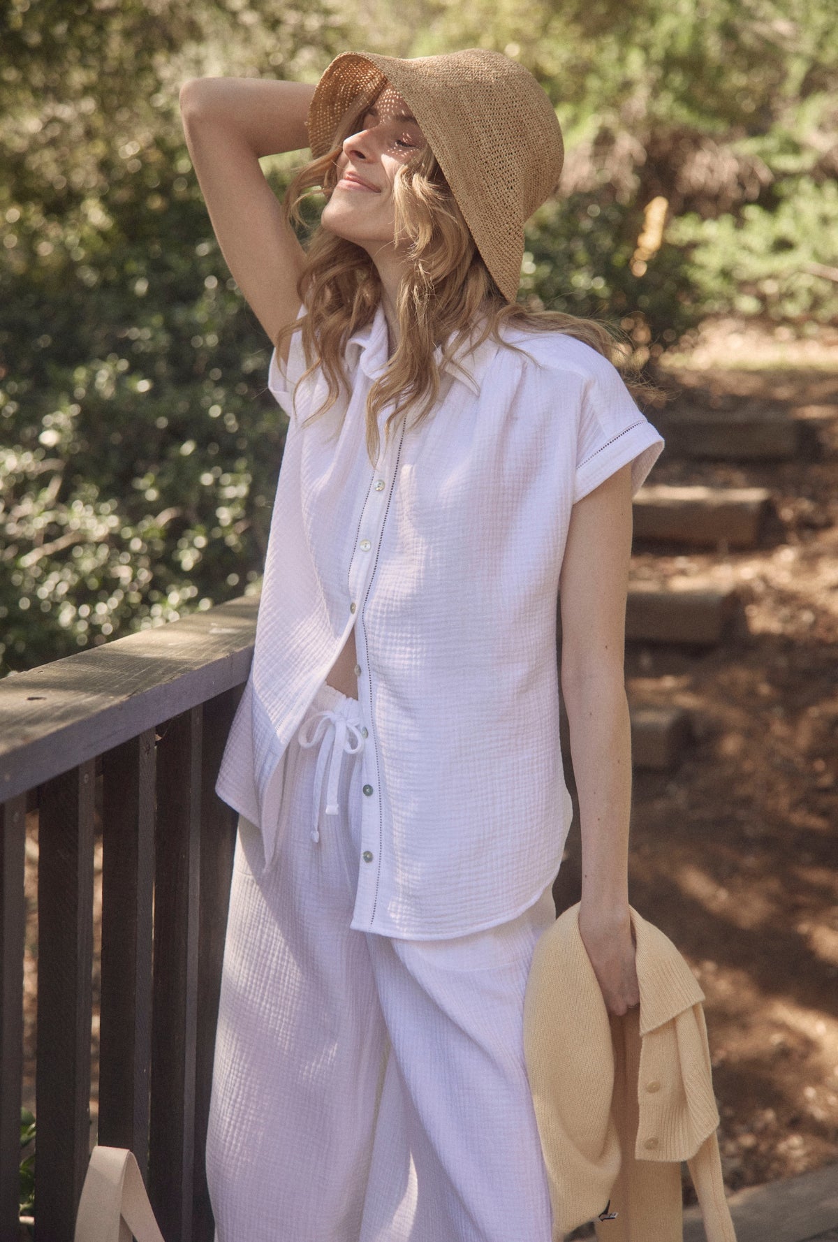 A lady wearing The &quot;Elora&quot; White Crinkle Gauze Lounge Set