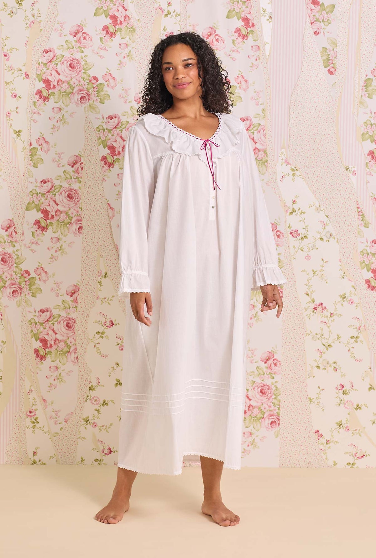 A lady wearing The "Clara" Iconic White Cotton Lawn Plus Size  Nightdress