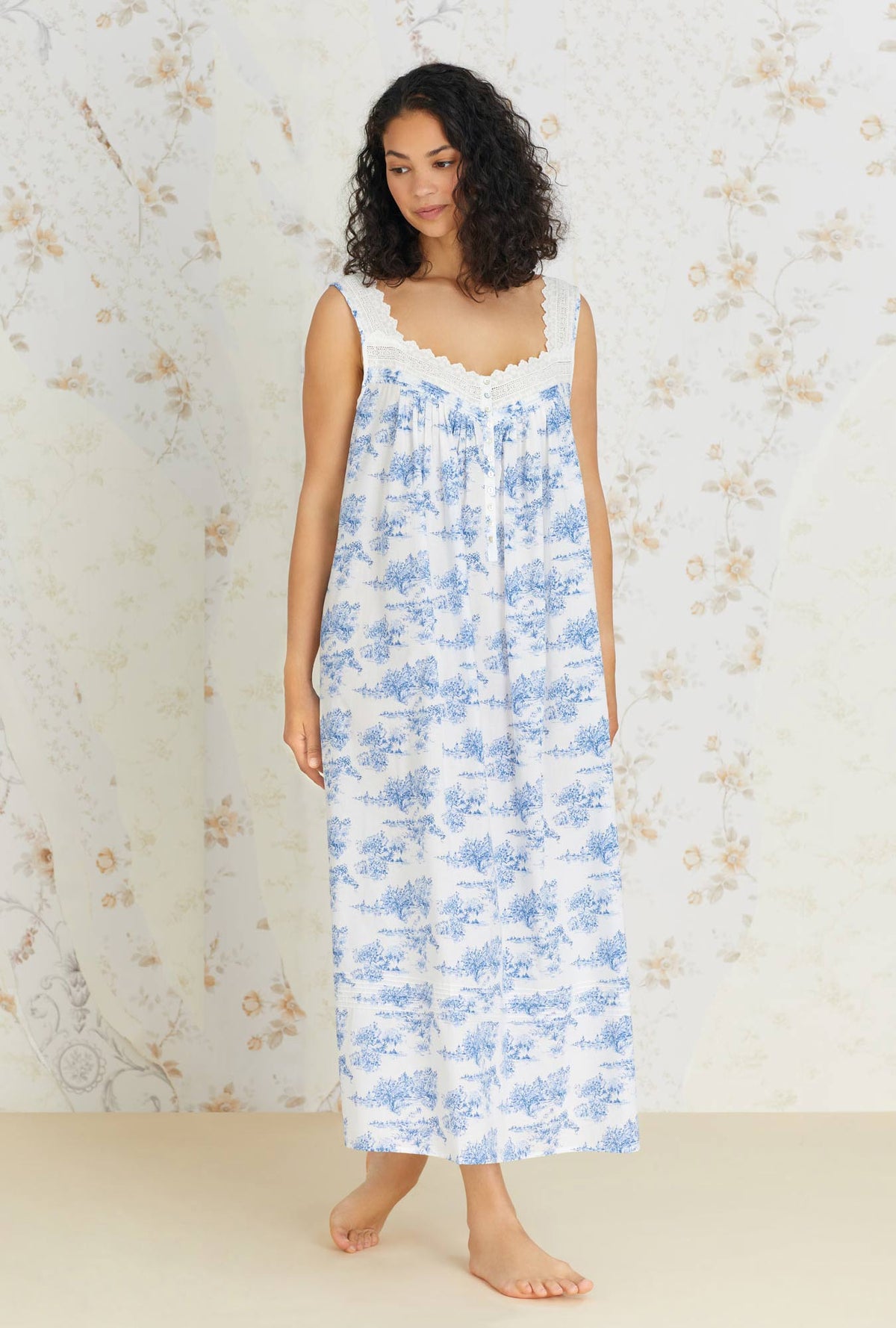 A lady wearing sleeveless french toile eileen cotton woven nightgown.