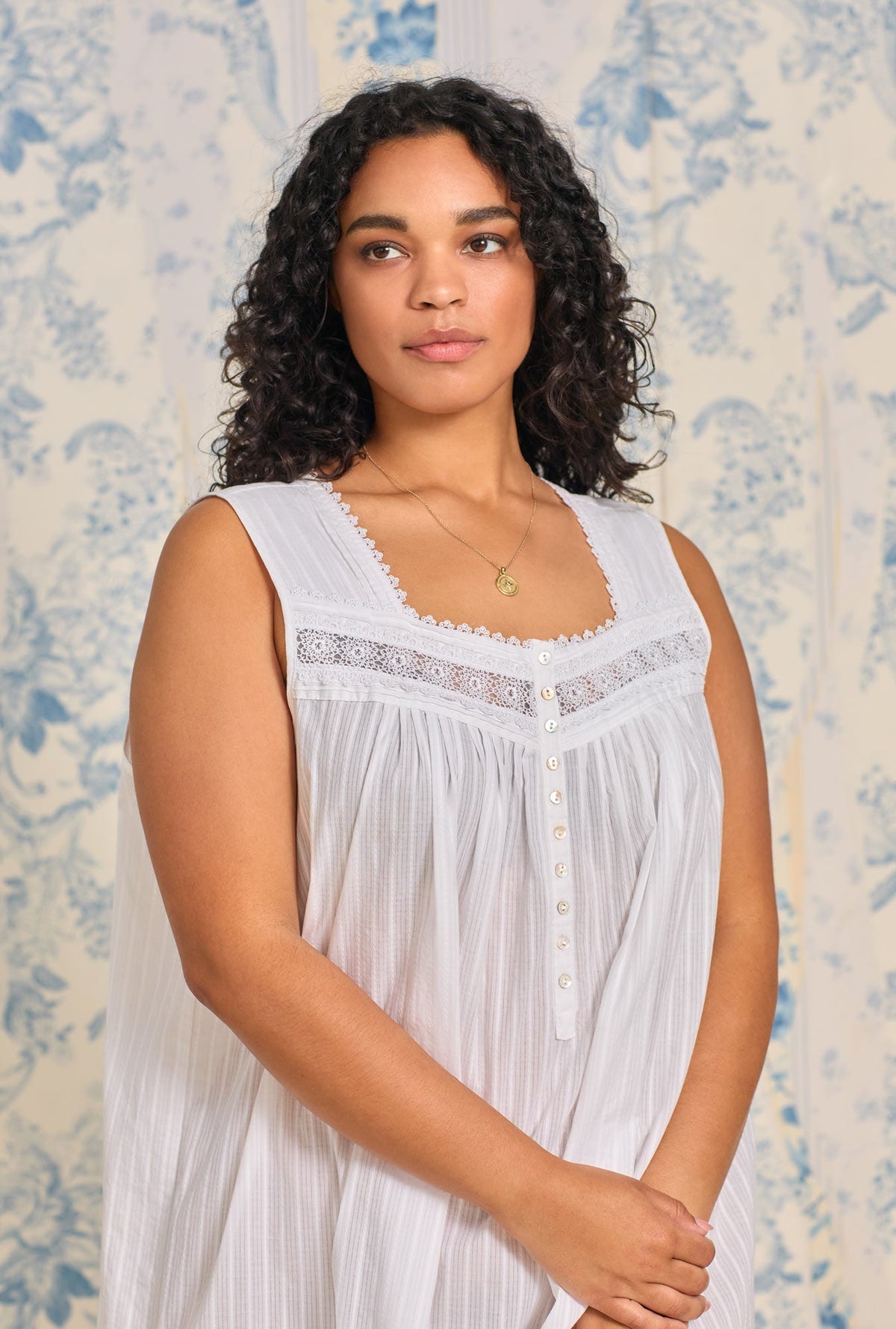 A lady wearing Dobby Stripe White Gown