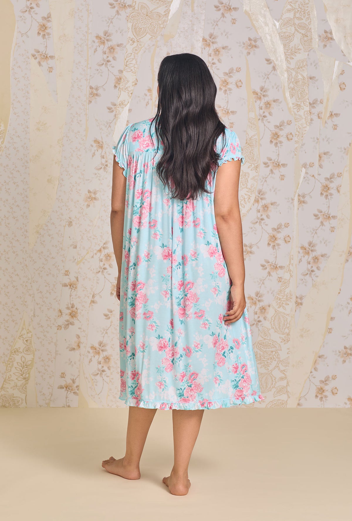 A lady wearing Floral Allover Tencel Waltz plus Gown