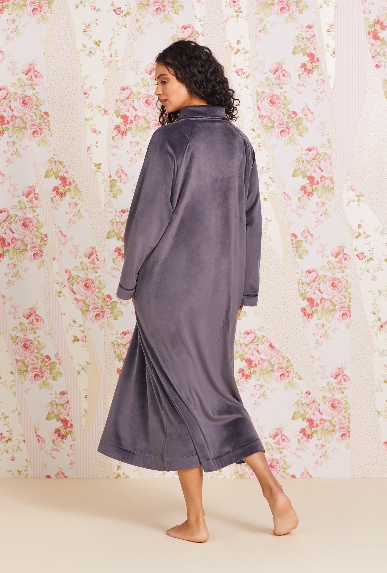 A lady wearing Lux Velour Long Zip Robe