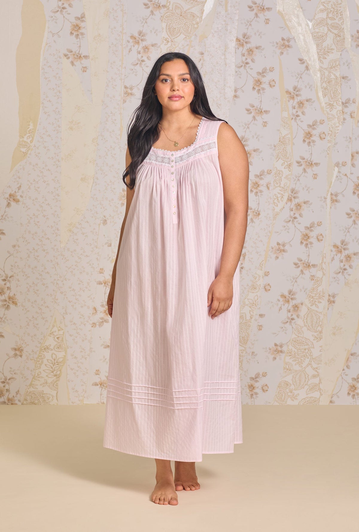 A lady wearing The "Eileen" Dobby Stripe Rose Gown