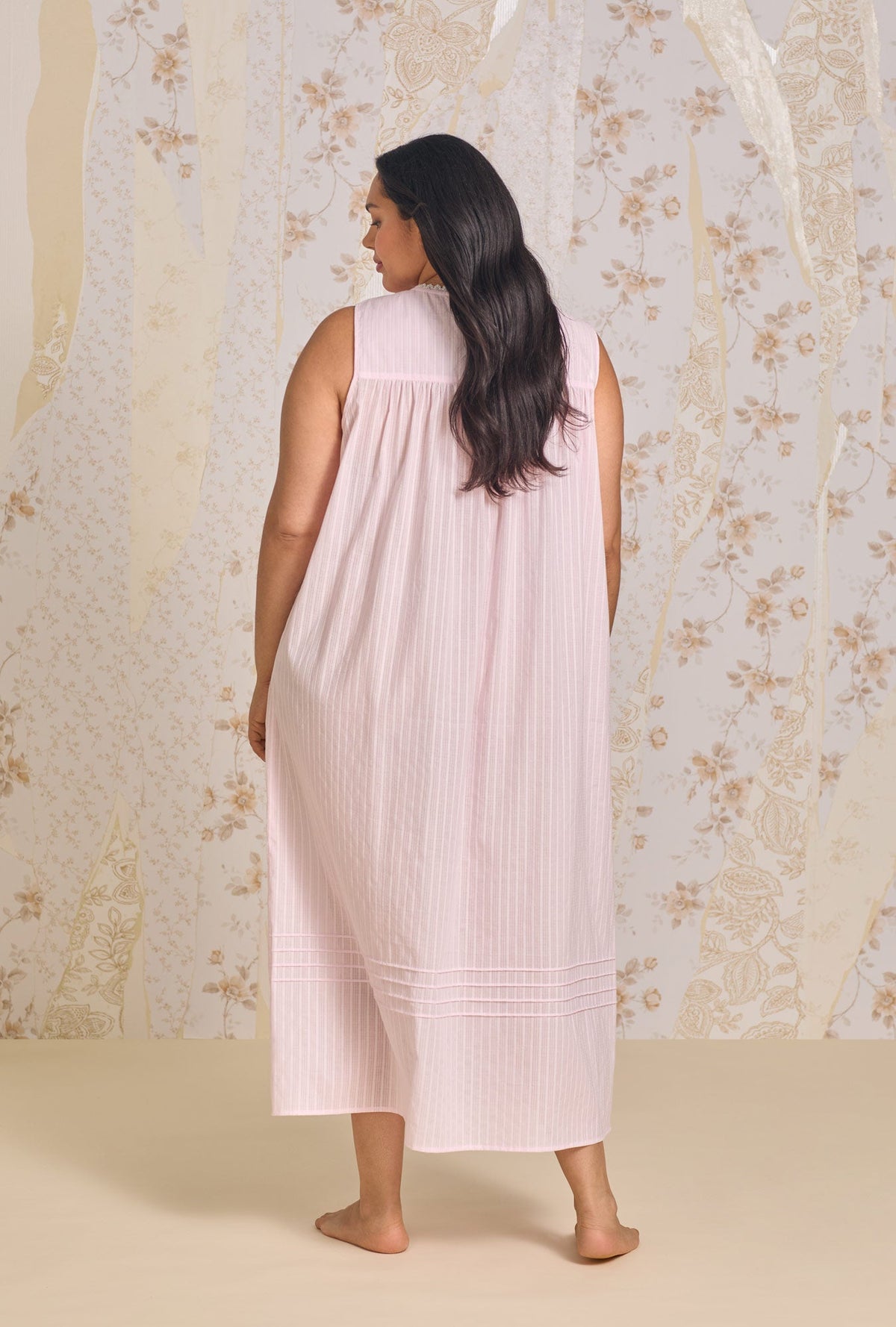 A lady wearing The "Eileen" Dobby Stripe Rose Plus Gown