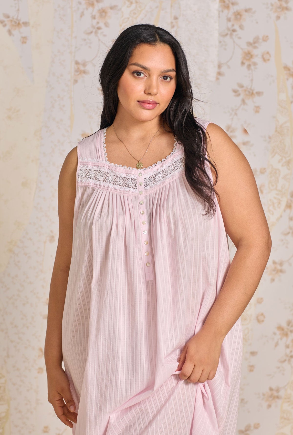 A lady wearing The "Eileen" Dobby Stripe Rose Plus Gown