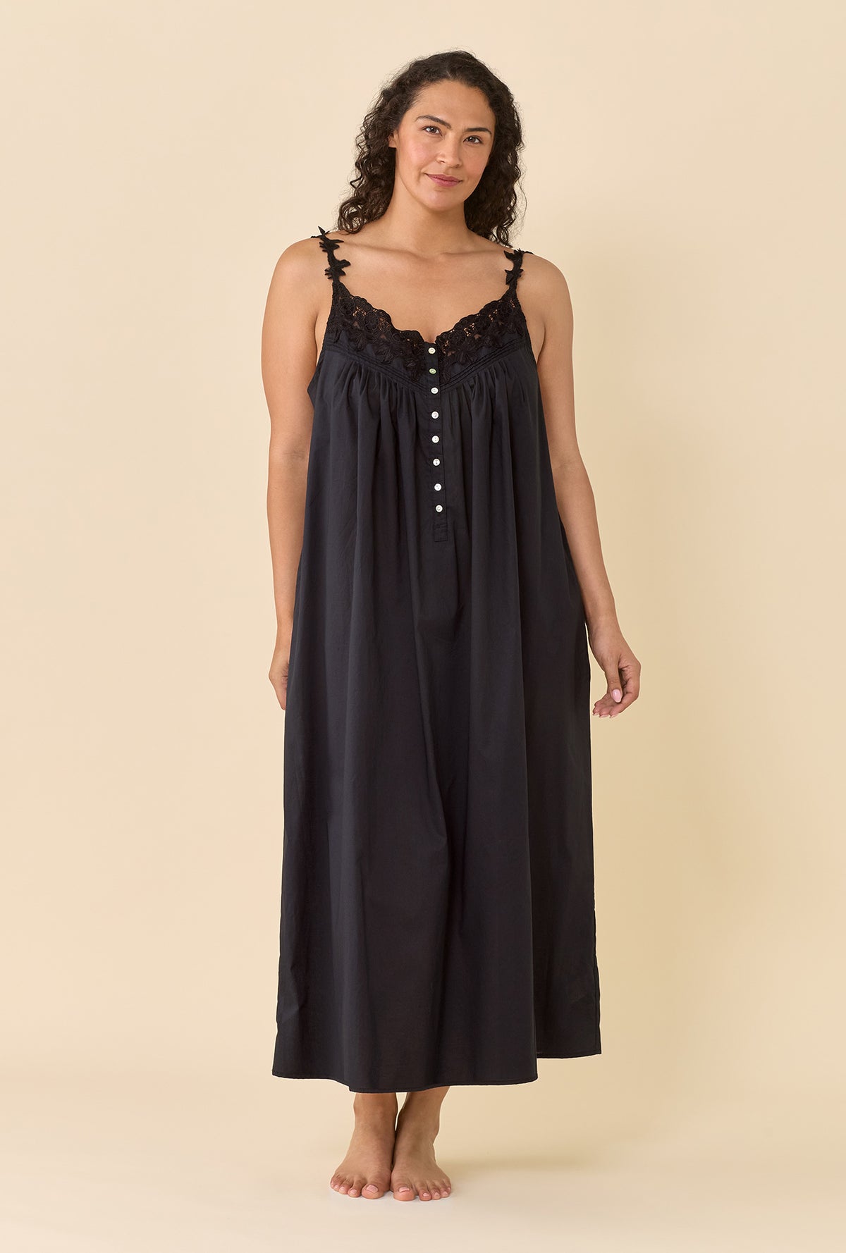 A lady wearing plus size black Florentine Lace Ballet Gown