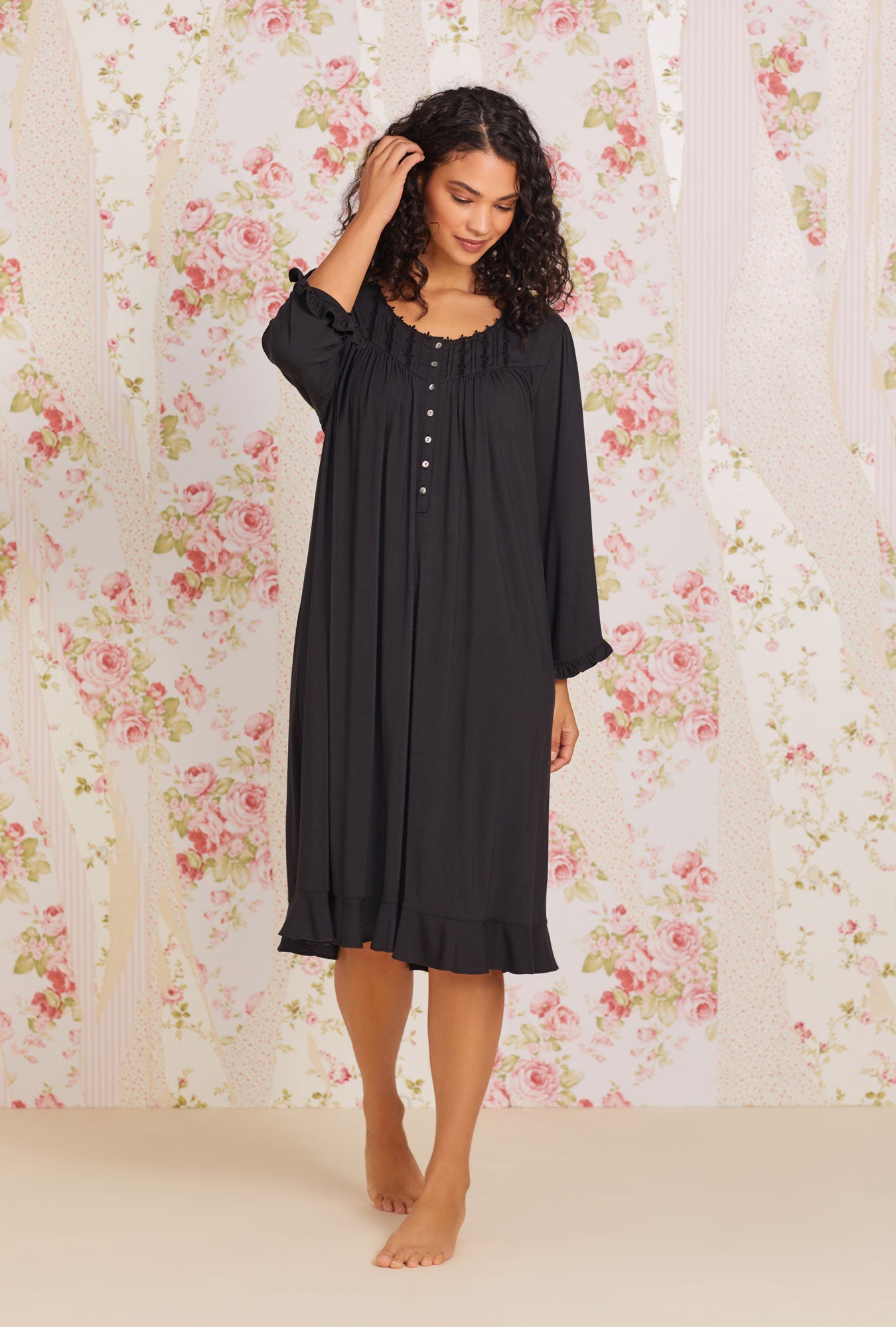 A lady wearing black long sleeve tencel modal nightgown plus.