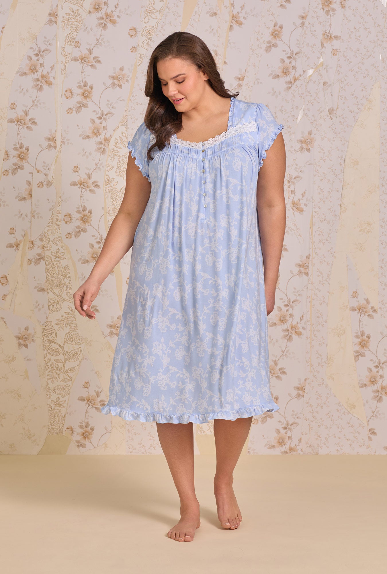 A lady wearing Blue Haven Tencel™ Modal Cap Sleeve Waltz Nightgown sitting in stairs 