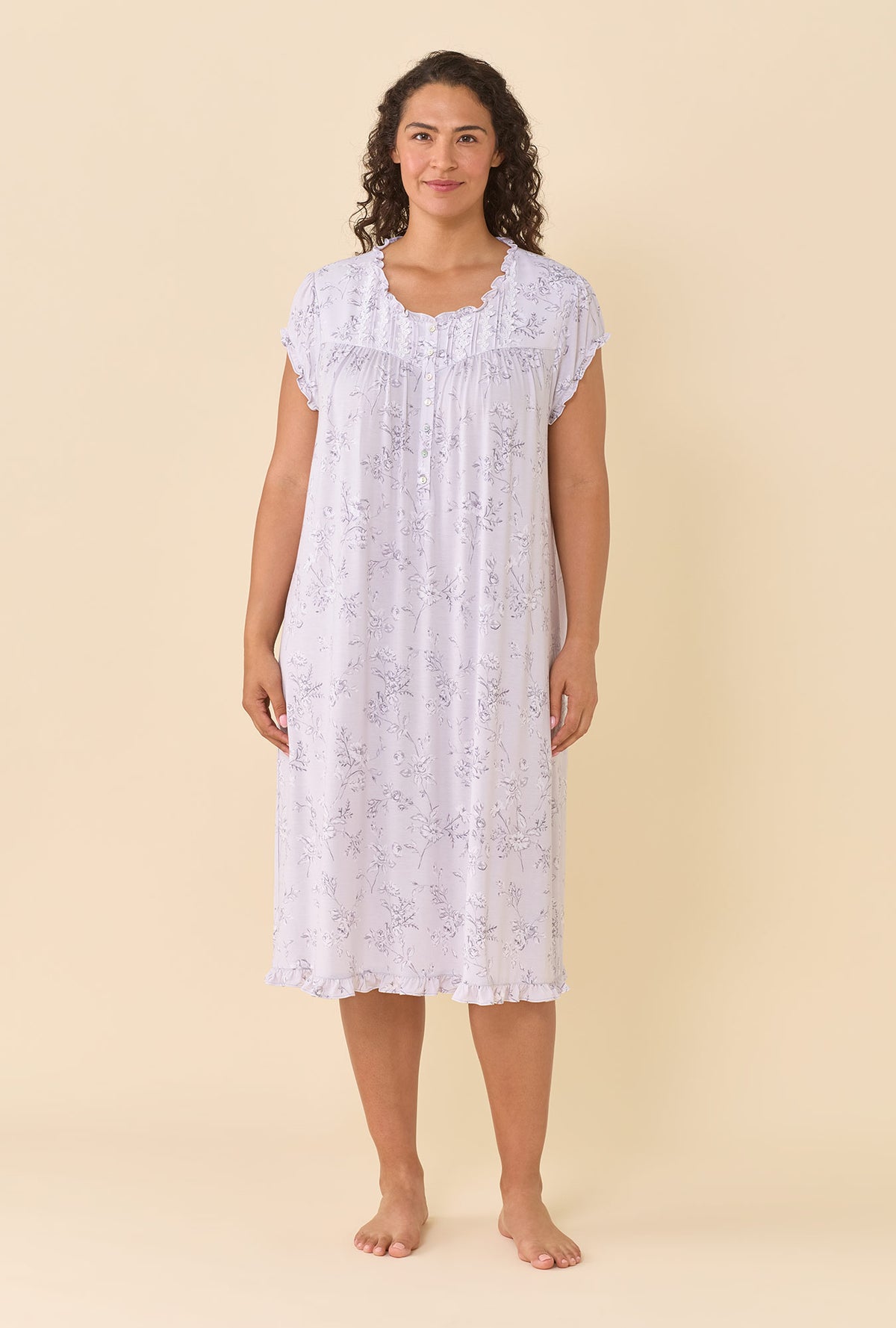 A lady wearing plus size Silver Garden Tencel™ Modal Spandex Jersey Knit Cap Sleeve Waltz Nightgown