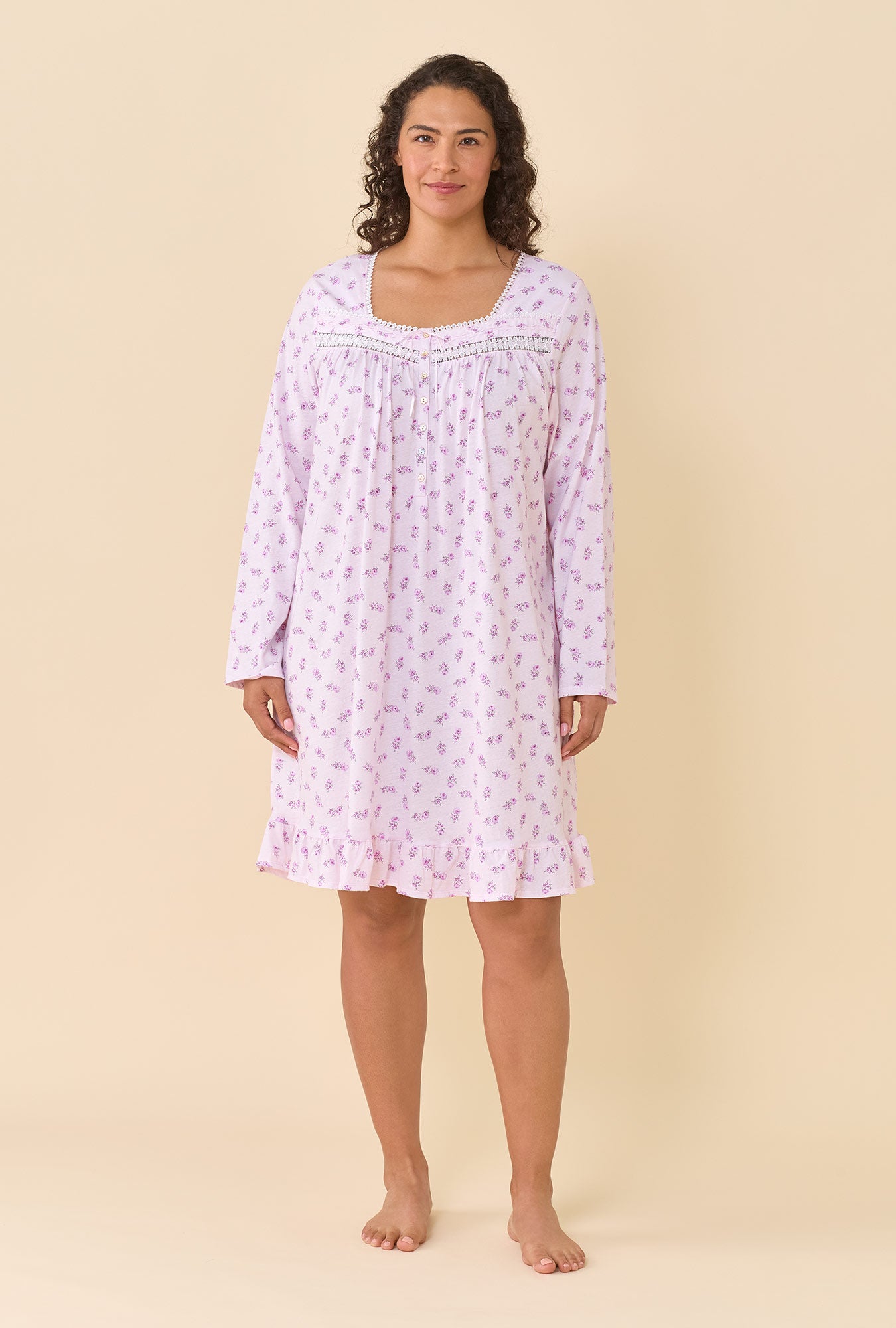 A lady wearing Scattered Floral 100% Cotton Jersey Knit Long Sleeve Chemise closer look looking up