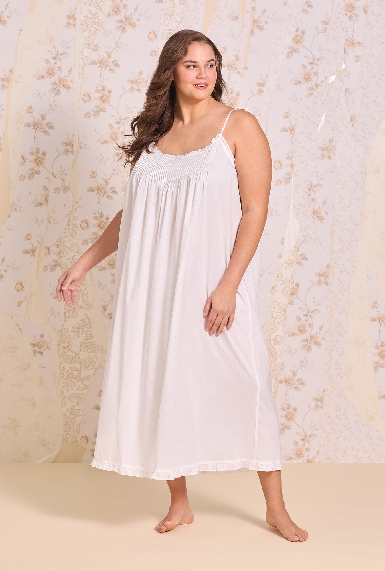 A lady wearing The "Lucille" Iconic White Cotton Lawn Ballet Nightgown