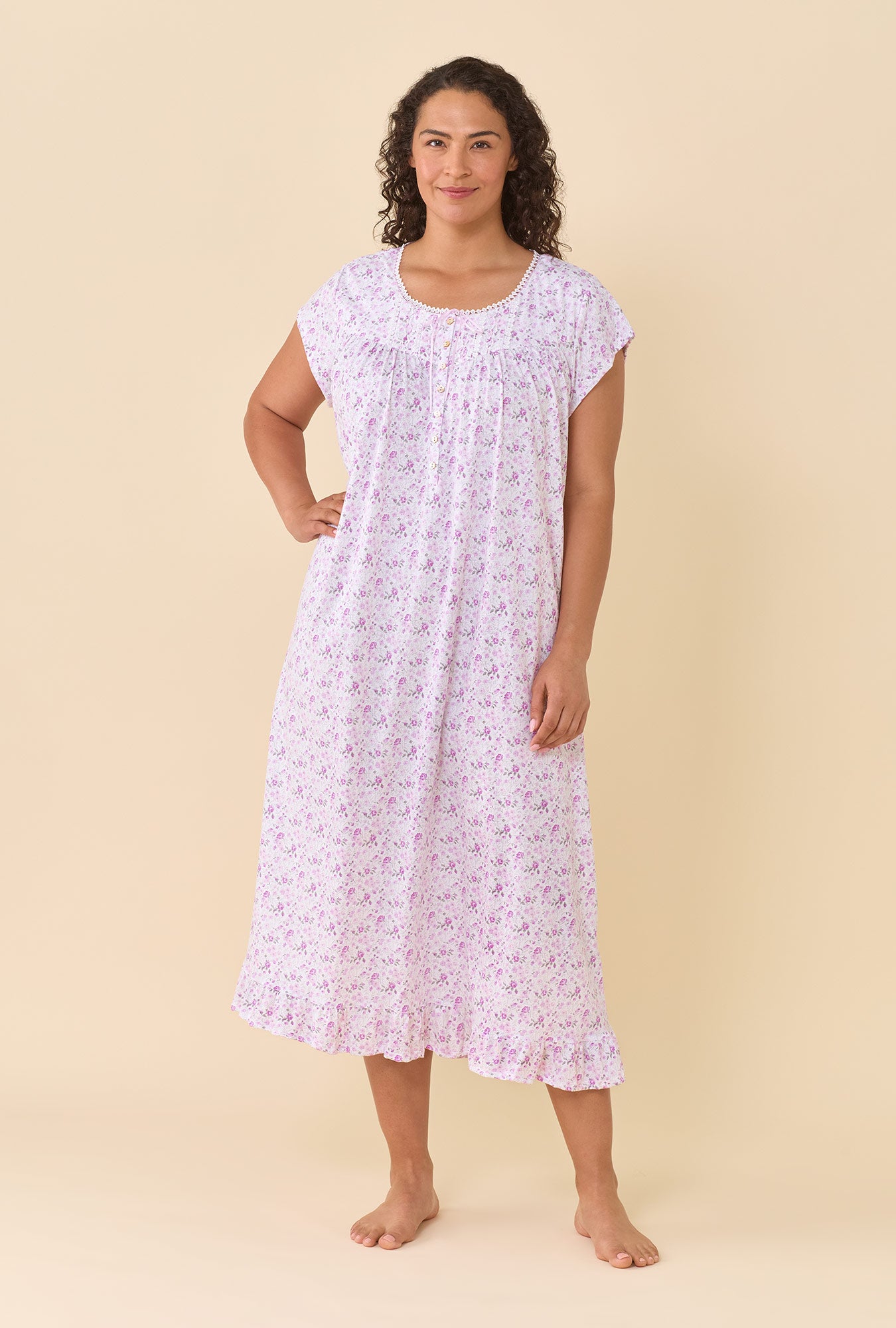 A lady wearing Cameo Ditsy 100% Cotton Jersey Knit Cap Sleeve Ballet Nightgown looking up