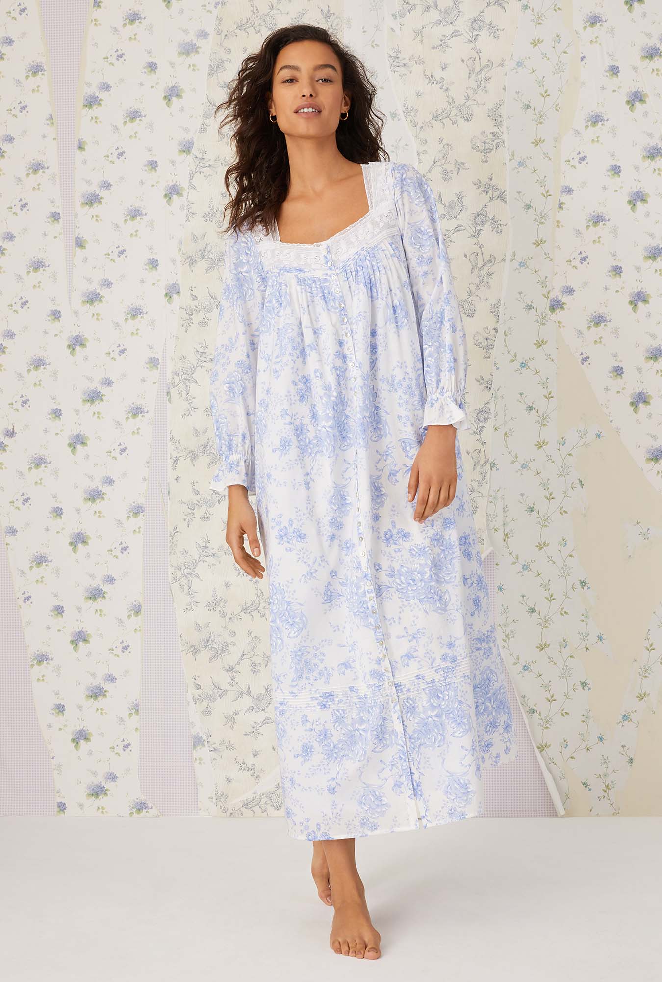A lady wearing long sleeve blue china cotton button front robe.