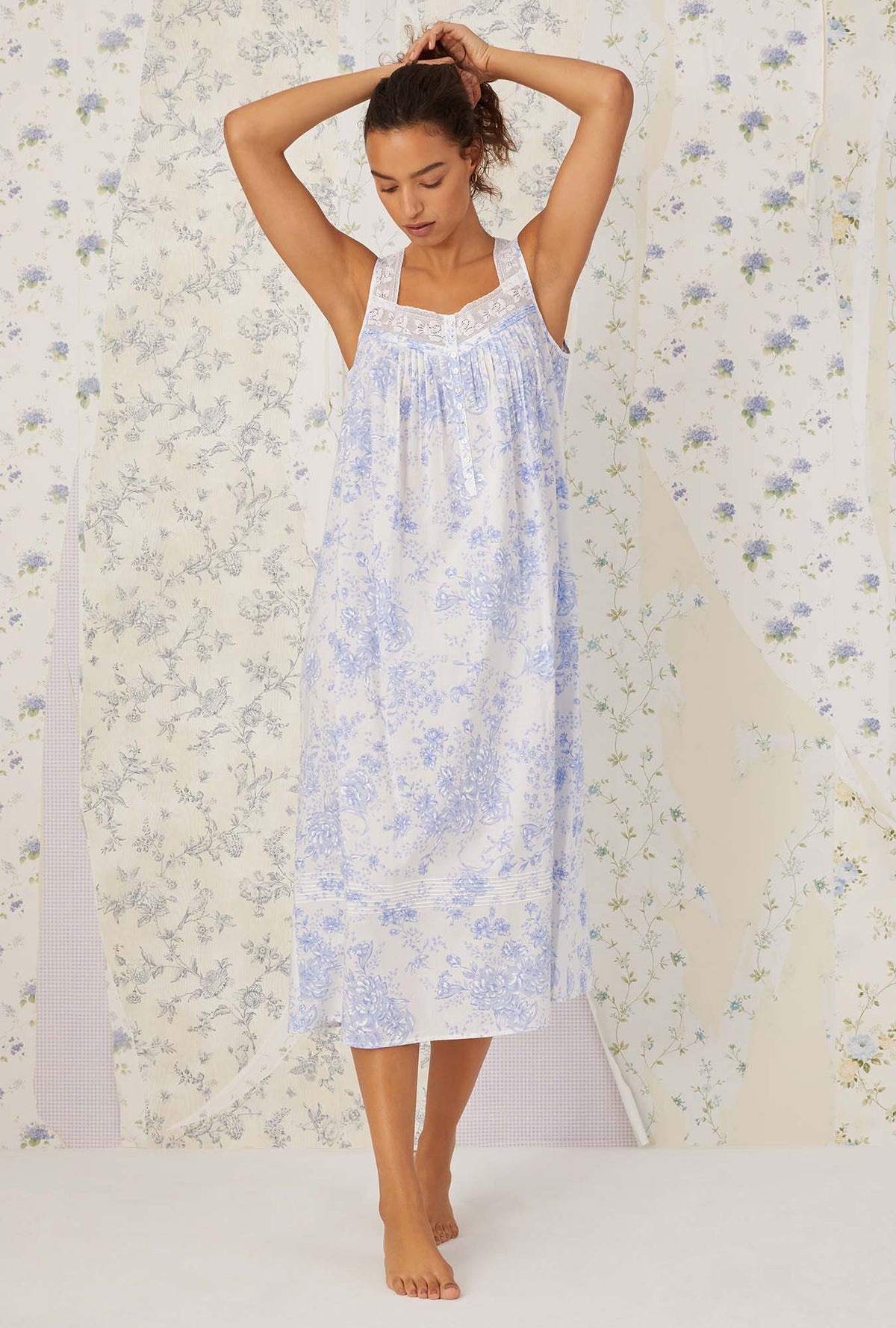 A lady wearing sleeveless blue china cotton eileen nightgown.