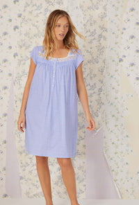 A lady wearing cap sleeve peri daisy cotton knit short nightgown.
