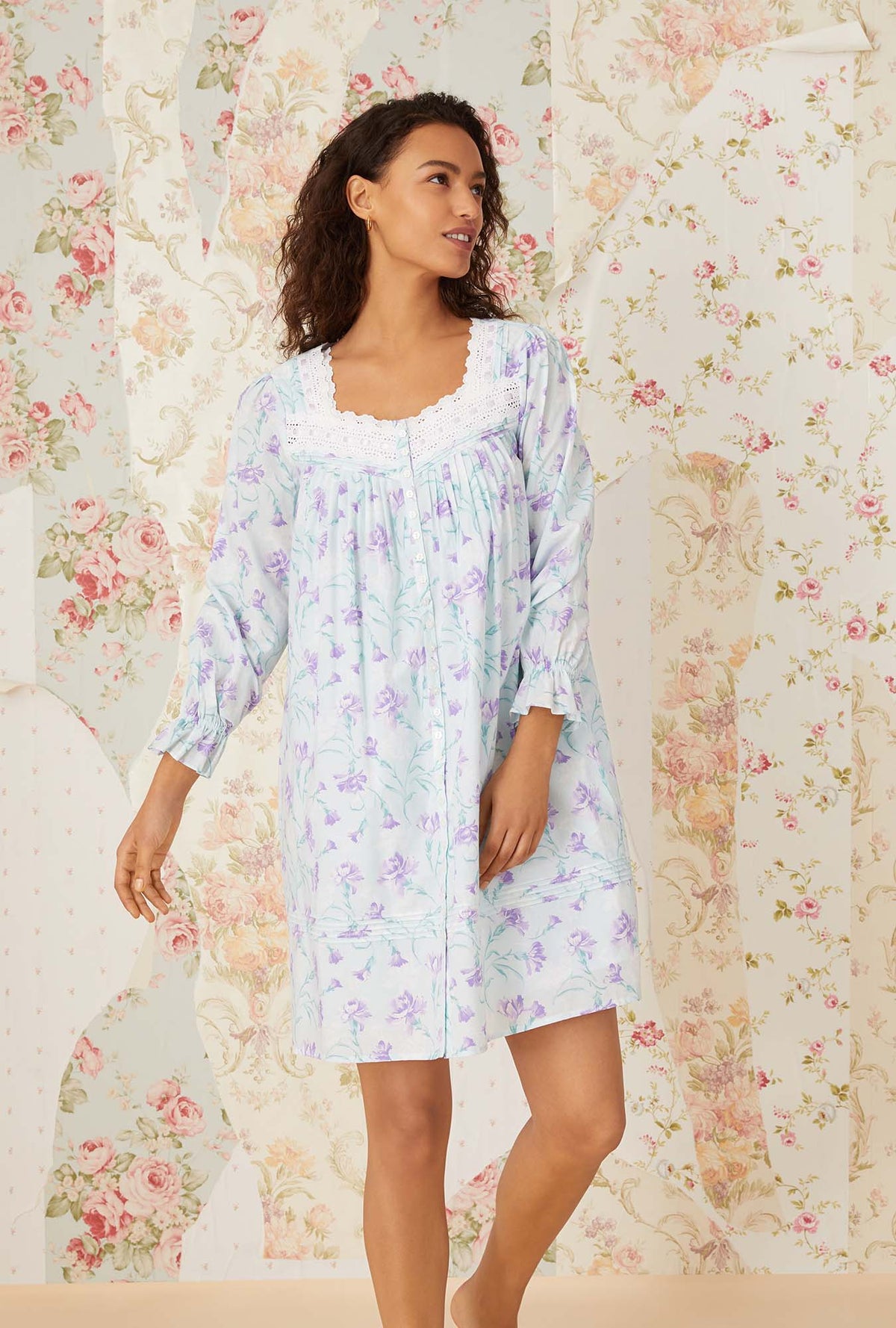 A lady wearing lavender carnations short robe.