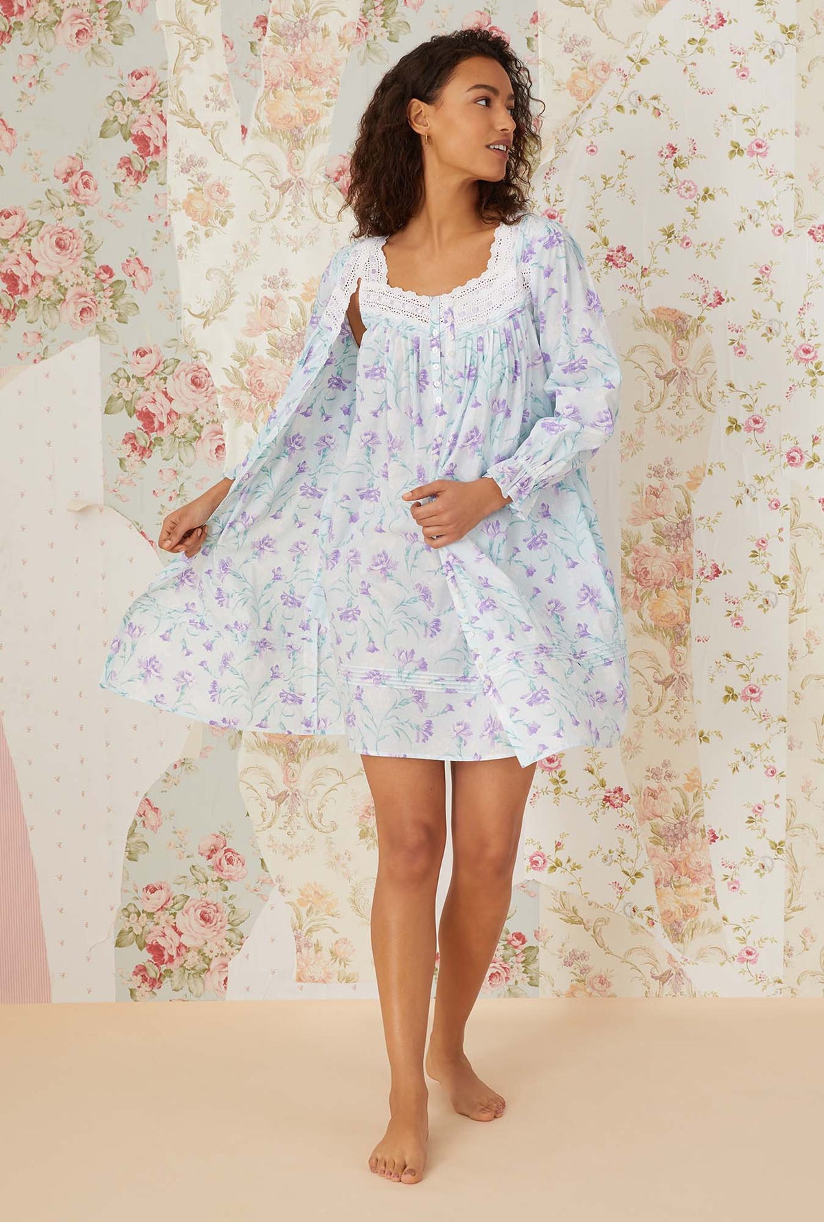 A lady wearing lavender carnations short robe.