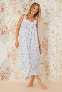 A lady wearing white sleeveless Eileen Nightgown with lavender carnations print