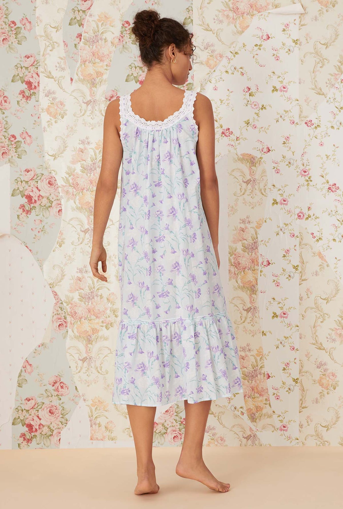 A lady wearing white sleeveless shelby Nightgown with lavender carnations print