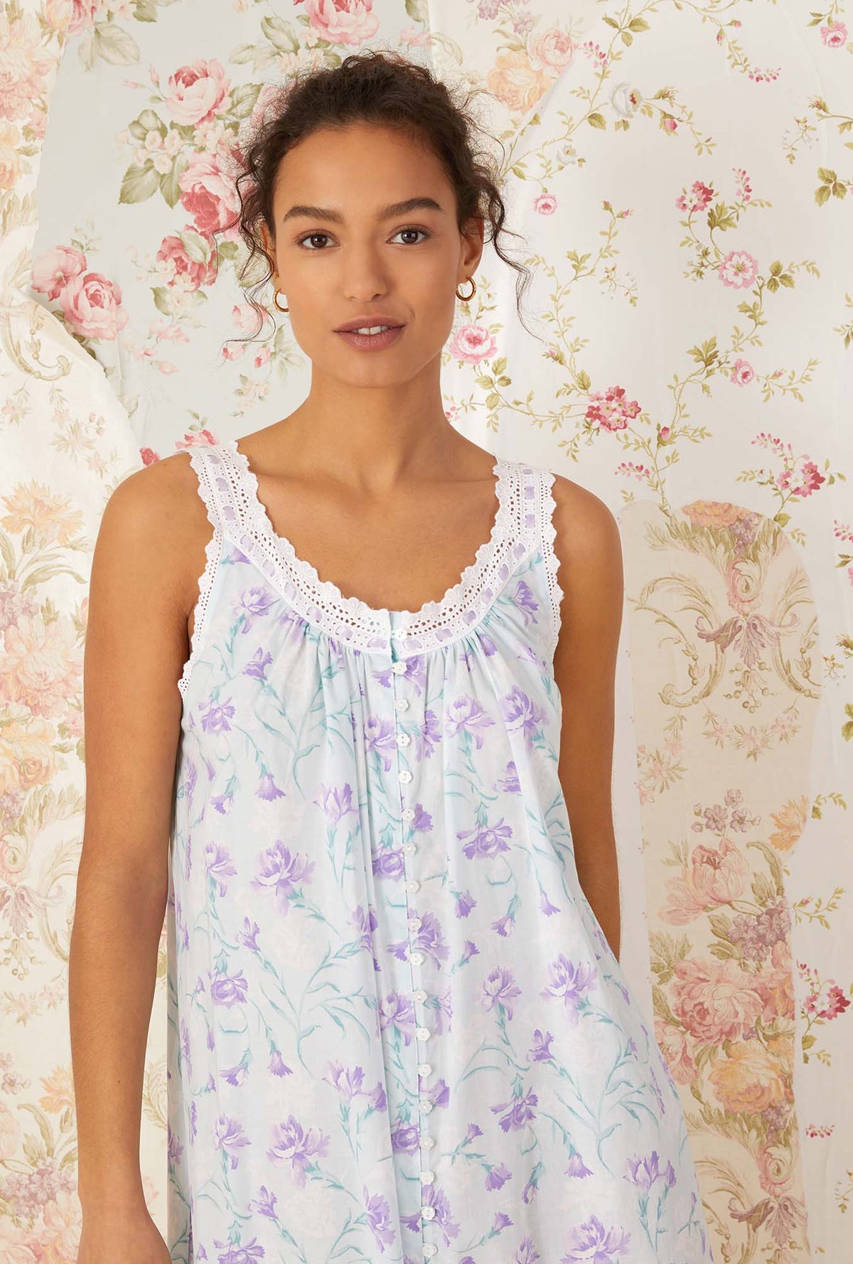 A lady wearing white sleeveless shelby Nightgown with lavender carnations print