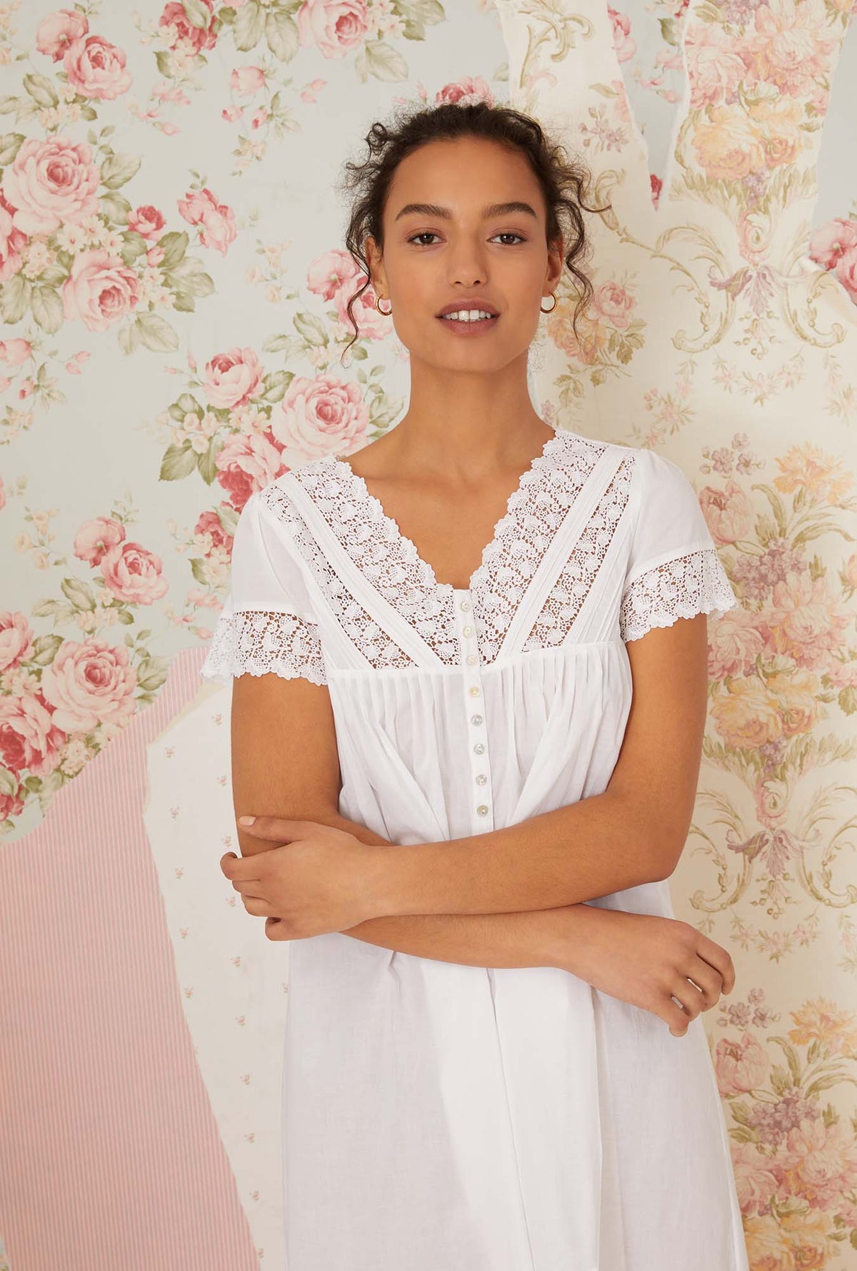 A lady wearing white short sleeve portofino waltz nightgown.