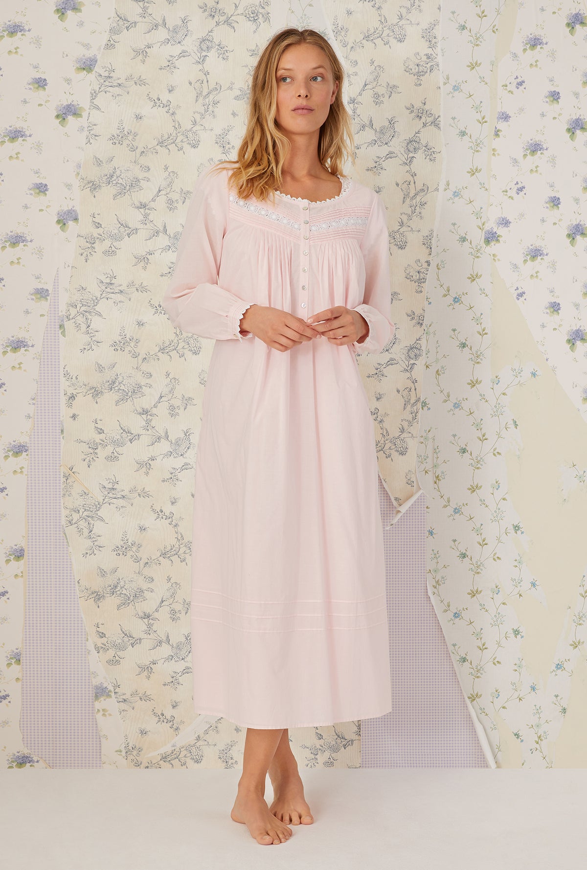 A lady wearing Heirloom Dream Long Sleeve Gown