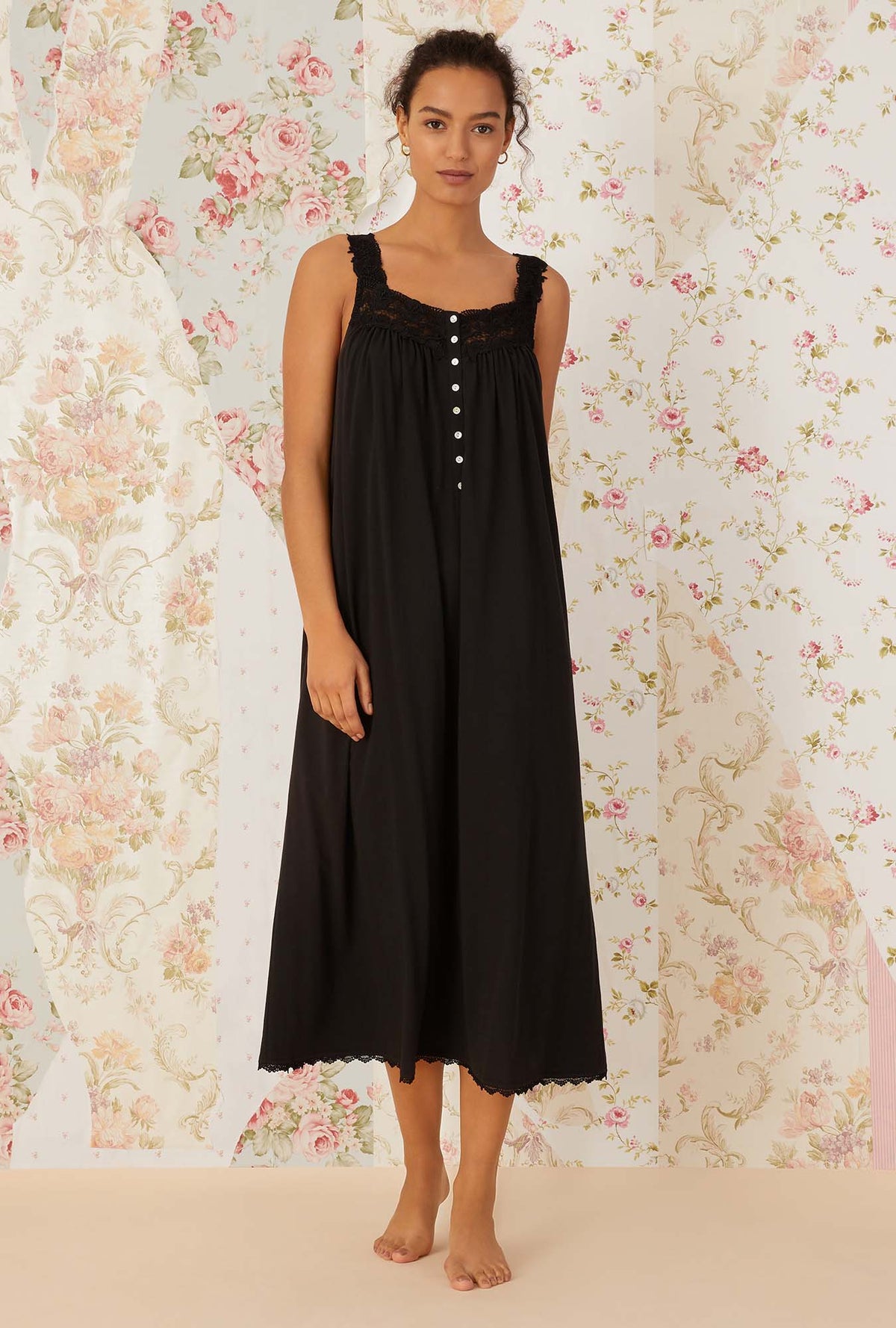 A lady wearing black sleeveless villa blanca knit ballet nightgown.