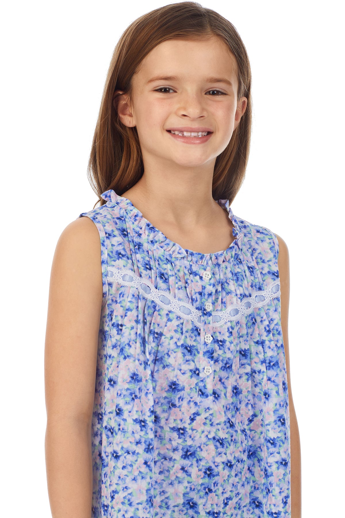 A girl wearing a sleeveless nightgown with blue floral pattern.
